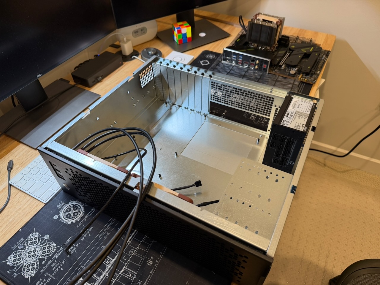 Empty CX3150x case next to the assembled motherboard